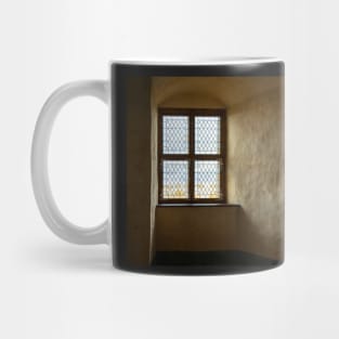 Dim light going through vintage stained-glass window Mug